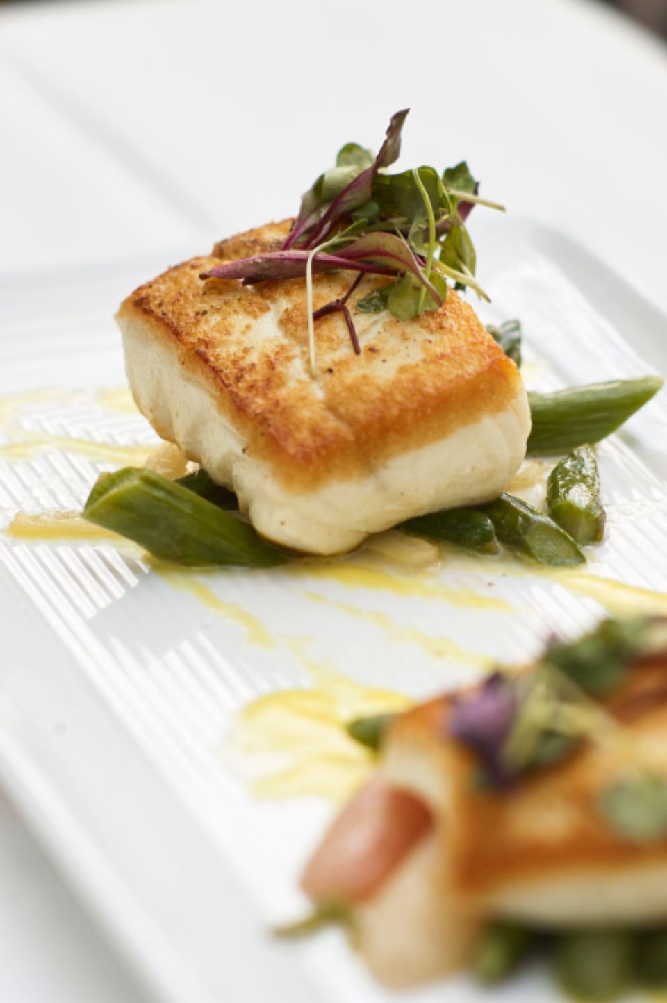 A seafood dish plated and ready to serve